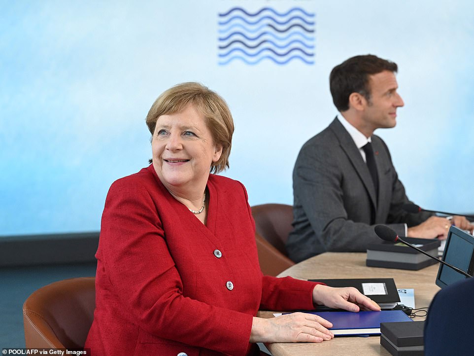 44629039-9722375-Angela_Merkel_pictured_with_Emmanuel_Macron_at_the_G7_summit_has-a-2_1624558492172.jpg