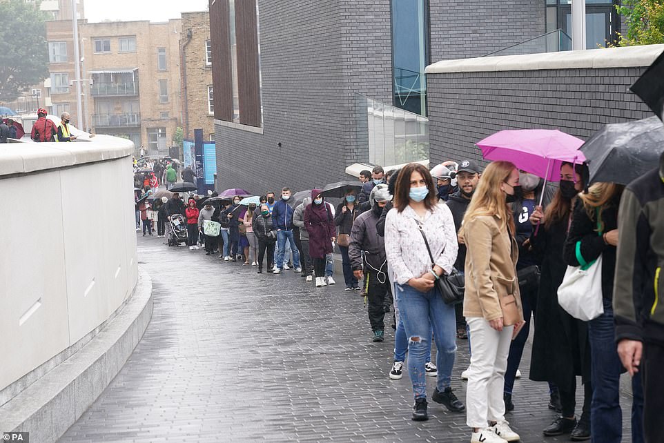 44453883-9705695-People_queue_at_an_NHS_Vaccination_Clinic_at_Tottenham_Hotspur_s-a-22_1624210488674.jpg