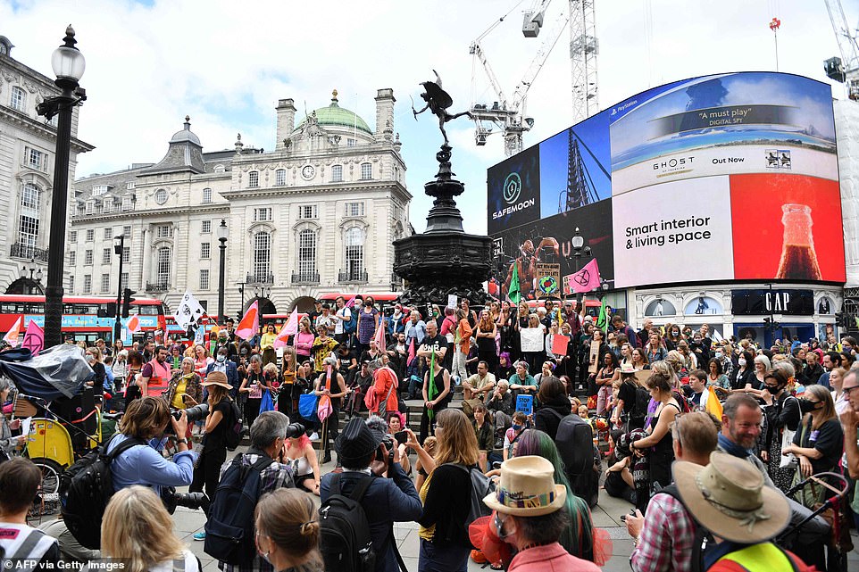 47083223-9925553-The_protesters_rammed_the_streets_in_Piccadilly_Circus_blocking_-a-31_1629910478355.jpg