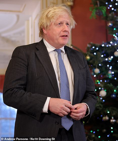52081009-10335485-Boris_Johnson_tonight_declared_that_Christmas_can_definitely_go_-m-7_1640169722816.jpg