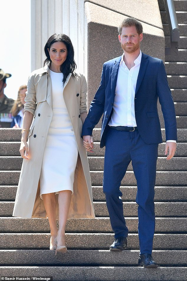 57323599-10776275-When_the_Sussexes_pictured_arrived_in_Australia_in_October_2018_-a-2_1651533593934.jpg